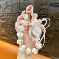 Dragonne de téléphone perlée avec breloque miroir pastel et nœud en perles blanc - Bijou de Téléphone Miroir Nœud Perlé / Blanc