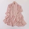 Detail view of the soft pink crepe hijab fabric draped elegantly on a wooden hanger - Rose Pink