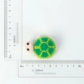 Handmade crochet turtle keychain with green geometric shell pattern and size scale - Green Handmade Knitted Turtle