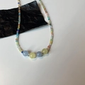 Detailed view of rainbow beaded necklace with colorful stones and blue yellow round beads - Blue and Yellow Cat Eye Stone Necklace (X44)