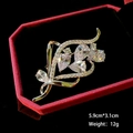Detailed view of flower brooch with zircons in a red velvet jewelry box with dimensions - B455 White/Flowing Floral Design