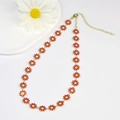 Golden necklace featuring red and yellow enamel daisies with adjustable lobster clasp - Large Flower Necklace / Red