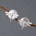 Creative S925 silver dragonfly stud earrings with white pearls on a natural wood branch - Silver