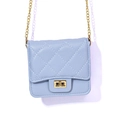 Ice blue quilted crossbody bag with gold chain strap and metallic twist lock closure - Blue