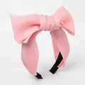 Stereo pink oversized bow headband made of smooth fabric for high cranial top hair styling - Pink