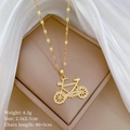 Detail of gold bicycle necklace with micro diamonds and weight size specifications - Bicycle Charm / Gold