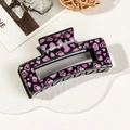 Detail of a large rectangular hair claw clip with pink heart prints on black finish - 8.5cm Heart Print - Style D Black Base