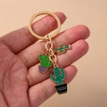 Pastoral style golden keychain featuring three green enamel cactus charms with hello engraving - Cactus