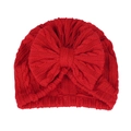 Détail d'un turban rouge tricoté pour bébé avec motif torsadé et un grand nœud - Taille unique / Rouge