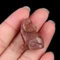 Miniature hand-carved natural strawberry crystal wolf statue in deep red tones - Purple Aventurine