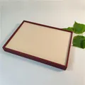 Macro view of 100-slot jewelry display tray with red frame and soft beige velvet lining - 88 Slots Red Woven Leather + Beige Velvet