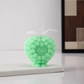 Close-up of mint green heart candle with rose relief and Love text detail - Style A / Green