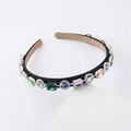 Detail of colorful rhinestones and velvet sponge headband with vintage jewels - Colorful