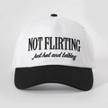 Front view of white and black baseball cap with NOT FLIRTING embroidery detail - Adjustable / White and Black Splicing