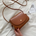 Classic caramel brown crossbody bag with gold snap button and stylish knot detail - Tan
