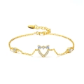 Golden 925 sterling silver bracelet featuring sparkling heart and bow charm details - 14K Gold Plated CZ Heart and Bow Bracelet 1.81g