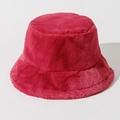 Detail shot of fluffy red faux fur texture on a warm winter bucket hat for women - One Size / Burgundy