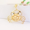 Exquisite gold crab keychain with beige opal shell and sparkling white crystal claws - Cat Eye Stone Crab Style / Gold