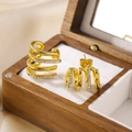 Luxurious gold C-shaped multilayer earrings with sparkling crystal pavé on white velvet - Gold Multi-layer Hollow