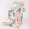 Microfiber beach towel with pink and green leaf pattern and white stitched edges - Q-Morandi Tones Plant Leaves