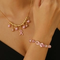 Pink ribbon hope necklace and bracelet set with pearls and rhinestones on a model - 'Hope' Pink Ribbon Necklace Bracelet 2-Piece Set