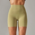 Detail of high-waisted seamless yoga shorts showing olive green matte fabric texture - Olive Green