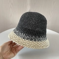 Detail of hand-woven straw bucket hat in chic black and beige contrast color design - M (56-58cm) / Black