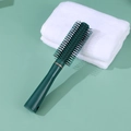 Dark green professional anti-static round styling hairbrush on matching green background - Green Round