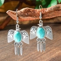 Macro shot of bohemian eagle earrings with turquoise stone and metal feathers on wood - Eagle Style Three Feathers (HQEF-1955)