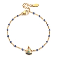 Detail of a gold stainless steel bracelet with blue beads and a colorful sailboat charm - Blue Beads (SL1185-BLUE)