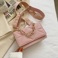 Detail of pink crossbody bag with geometric quilting and wide decorative strap - Pink