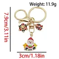 Golden Santa Claus Christmas keychain with snowflake and gift box charms weight 11.9g - ER1790-Crystal Snowflake Piano Santa Gift Box 8-shape Keychain