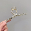Elegant gold alloy shark hair claw clip with pavé crystals in a cross-loop design - Classic Cross Rhinestone
