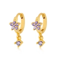 Detailed view of gold hoop earrings with purple zircon flower and round drop charms - Purple Gold