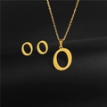 Detailed view of golden capital letter O pendant necklace and matching stud earrings set - Letter O / Gold