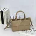 Beige hand-woven leather tote bag with dual handles and adjustable shoulder strap - Milk Tea
