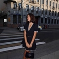 Elegant black short-sleeved mini dress with V-neckline and white lace trim accents - S / Black