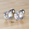 Macro shot of 6mm round cubic zirconia stud earrings with a four-prong setting - 6mm / Silver