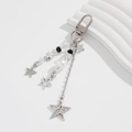Star charm keychain with silver chains, black beads and white pearl on white background - Minimalist Silver Star