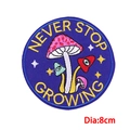 Detailed view of 8cm mushroom embroidery patch with Never Stop Growing slogan - Never Stop Growing Mushrooms