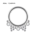 Detailed macro view of silver stainless steel septum clicker ring with 1.2x8mm sizing - NO 3 (Beads & Zirconia)