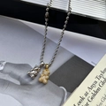 Collar de acero de titanio con colgantes de oso en plata y oso dorado con circonitas - Colgante Doble / Cadena de Bolas / Circón Dorado y Oso de Plata Brillante