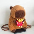 Plush brown Capybara backpack for kids featuring a cute plush french fries toy accessory - Fries Style (Webbing Strap)