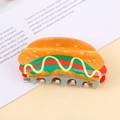 Macro detail of dopamine-style hot dog hair claw clip made of vibrant acrylic acetate - Hamburger