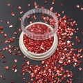 Macro detail of red iridescent crushed glass flakes for nail art and DIY crafts in a jar - 1.5-3MM Canned / Electroplated Brown Red
