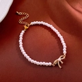 Elegant pearl bracelet with a golden bow pendant and pavé zircon stones on satin background - 2# Bracelet-Gold-Butterfly-Gold Plated