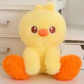 Cute sitting yellow plush chick doll with fluffy long fur and soft orange details - Yellow Duck