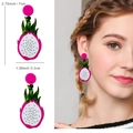Detail view of dragon fruit acrylic earrings with dimensions 7cm by 3.2cm on model - Dragon Fruit