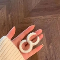 Close-up of fluffy white faux fur hoop earrings with a cozy winter aesthetic - Large White Plush Hoop Style