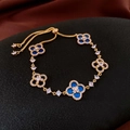 Elegant gold clover bracelet featuring deep blue enamel charms and sparkling white zircons - No.60 Blue Zircon Four-Leaf Clover Five-Flower Bracelet-Gold-Blue